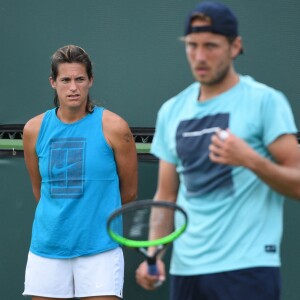 Amélie Mauresmo à l'entraînement avec Lucas Pouille lors du tournoir d'Indian Wells, le 5 mars 2019.