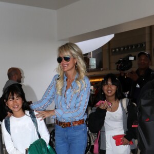 Semi-exclusif - Laeticia Hallyday et ses filles Jade et Joy arrivent à l'aéroport de LAX à Los Angeles pour prendre un vol pour la France le 14 juin 2019. Laeticia a enregistré ses baggages au comptoir d'Air France avant de retirer de l'argent à un distributeur automatique de billets pour donner un pourboire au porteur de ses valises. Laeticia Hallyday sera présente le samedi 15 juin à Toulouse pour l'inauguration de l'esplanade qui portera le nom de Johnny Hallyday, devant la salle de concert du Zénith. Elle passera par la suite une dizaine de jours en France avant de repartir pour Saint-Barthélemy.