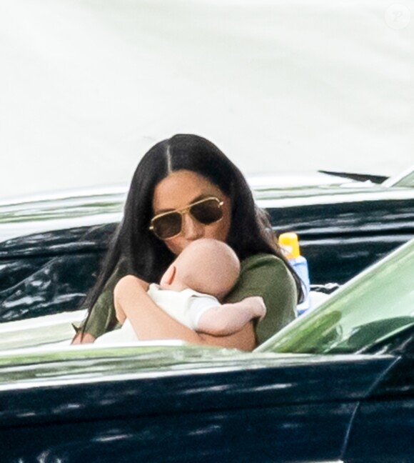 Meghan Markle, duchesse de Sussex et son fils Archie Harrison Mountbatten-Windsor lors d'un match de polo de bienfaisance King Power Royal Charity Polo Day à Wokinghan, comté de Berkshire, Royaume Uni, le 10 juillet 2019.