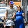 Exclusif - Chelsea Clinton enceinte et son mari Marc Mezvinsky se promènent avec leurs enfants Charlotte et Aidan à New York, le 15 juillet 2019.
