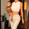 Kylie Jenner à la sortie de l'hôtel "The Mark" avec sa fille Stormi à New York, le 7 mai 2019. La petite Stormi porte les baskets Nike de la collaboration de son père T. Scott avec la marque américaine "T. Scott x Nike Air ".