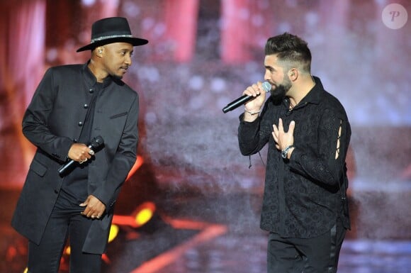 Soprano et Kendji Girac lors de l'enregistrement de l'émission "La Chanson Challenge 2019" aux Arènes de Nîmes. Le samedi 17 août 2019, TF1 lancera à 21h05 un nouveau divertissement baptisé "La chanson challenge". Durant cette émission produite par DMLSTV, plusieurs artistes français se lanceront des challenges autour de la musique. Pendant deux mois, ces chanteurs et comédiens se sont lancé à tour de rôle des défis sur les réseaux sociaux : interpréter un titre à l'opposé de leur univers habituel. © Guillaume Gaffiot/Bestimage