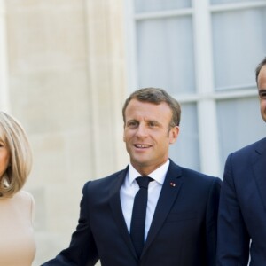 La première dame Brigitte Macron, le président Emmanuel Macron, Kyriakos Mitsotakis, premier ministre de la République Hellénique, Mareva Grabowski - Le président de la République française reçoit le premier ministre de la République Hellénique au palais de l'Elysée à Paris le 22 août 2019. © JB Autissier / Panoramic / Bestimage