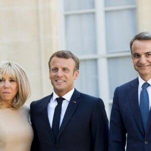 La première dame Brigitte Macron, le président Emmanuel Macron, Kyriakos Mitsotakis, premier ministre de la République Hellénique, Mareva Grabowski - Le président de la République française reçoit le premier ministre de la République Hellénique au palais de l'Elysée à Paris le 22 août 2019. © JB Autissier / Panoramic / Bestimage