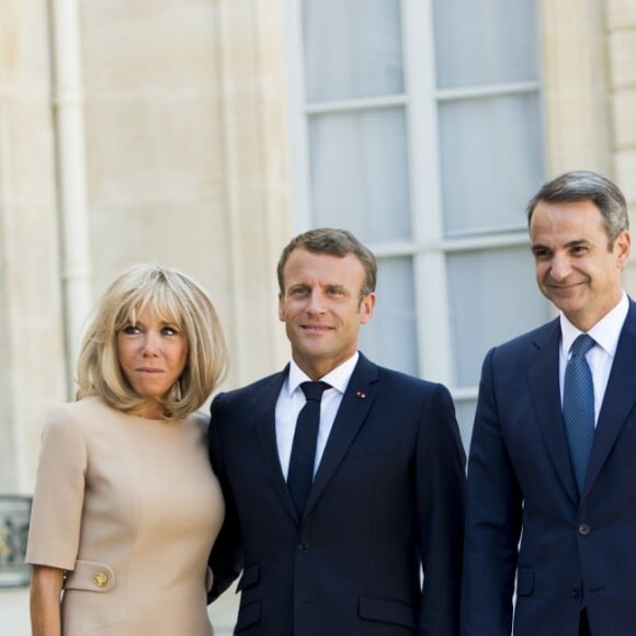 La première dame Brigitte Macron, le président Emmanuel Macron, Kyriakos Mitsotakis, premier ministre de la République Hellénique, Mareva Grabowski - Le président de la République française reçoit le premier ministre de la République Hellénique au palais de l'Elysée à Paris le 22 août 2019. © JB Autissier / Panoramic / Bestimage