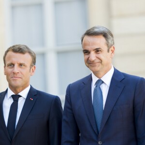 La première dame Brigitte Macron, le président Emmanuel Macron, Kyriakos Mitsotakis, premier ministre de la République Hellénique, Mareva Grabowski - Le président de la République française reçoit le premier ministre de la République Hellénique au palais de l'Elysée à Paris le 22 août 2019. © JB Autissier / Panoramic / Bestimage