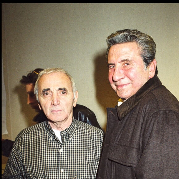 ARCHIVES - Charles Aznavour dans les loges avec Gilbert Bécaud. Le 18 décembre 2000.