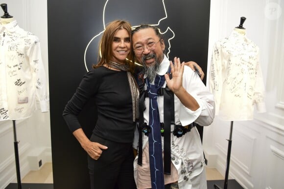Carine Roitfeld et Takashi Murakami assistent au vernissage de l'exposition "A Tribute to Karl Lagerfeld: The White Shirt Project". Paris, le 25 septembre 2019.