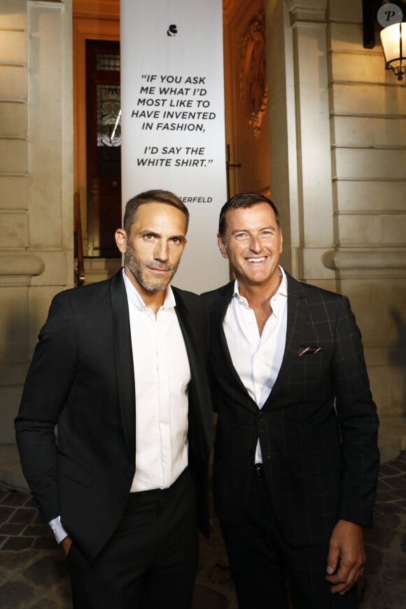 Sebastien Jondeau et Pier Paolo Righi assistent au vernissage de l'exposition "A Tribute to Karl Lagerfeld: The White Shirt Project". Paris, le 25 septembre 2019.