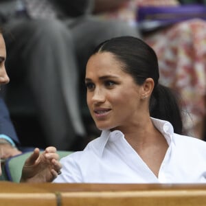 Catherine (Kate) Middleton, duchesse de Cambridge, Meghan Markle, duchesse de Sussex, et Pippa Middleton dans les tribunes lors de la finale femme de Wimbledon "Serena Williams - Simona Halep (2/6 - 2/6) à Londres, le 13 juillet 2019.