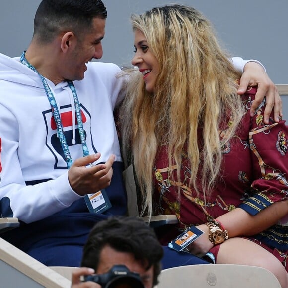 Exclusif - Marion Bartoli et son nouveau compagnon le joueur de football belge Yahya Boumediene s'embrassent dans les tribunes des Internationaux de France de Tennis de Roland Garros à Paris. 22 Mai 2019.