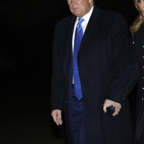 Le président Donald Trump et sa femme Melania arrivent à la Maison Blanche à Washington après un déplacement à Dover le 21 novembre 2019.
