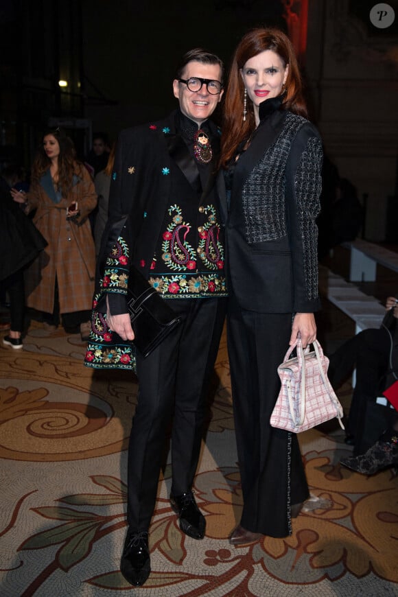 Adam Leja et Alexandra Mas assistent au défilé Antonio Grimaldi, collection Haute Couture printemps-été 2020, au Palais de la découverte. Paris, le 20 janvier 2020.