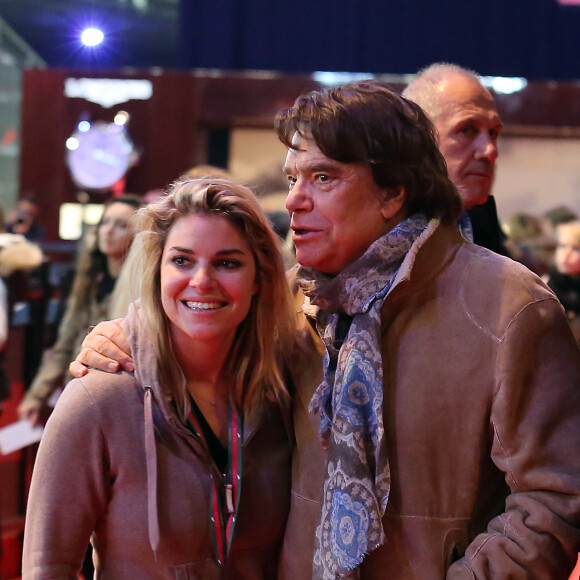 Bernard Tapie et sa fille Sophie - Dans le cadre du Gucci Paris Masters a eu lieu l'epreuve "Style & Competition for AMADE" a Villepinte le 7 décembre 2013.