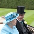 La reine Elizabeth d'Angleterre, le prince Philip, duc d'Edimbourg, le prince Harry aux courses Royal Ascot à Berkshire le 19 juin 2014.