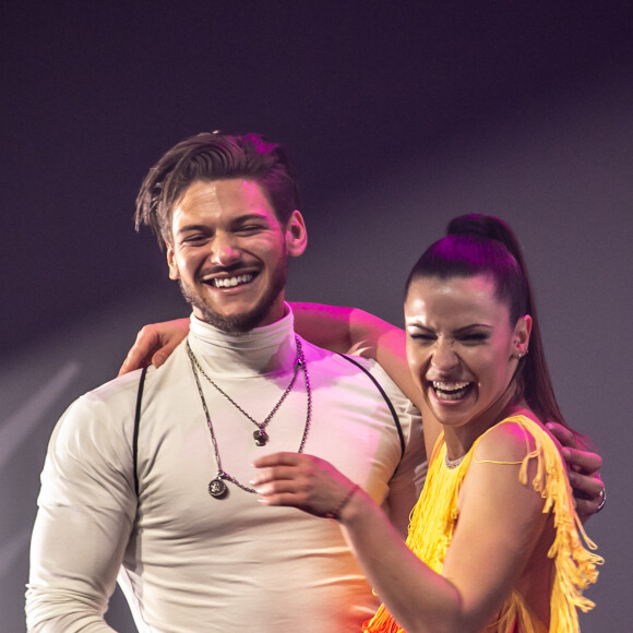 Exclusif - Denitsa Ikonomova et Rayane Bensetti - La troupe "EntreNous By D'Pendanse" en tourne&769;e au Dôme de Paris - Palais des Sports, à Paris, France, le samedi 7 Mars 2020. EntreNous By D'Pendanse est une troupe composée de 8 danseurs aux personnalités différentes mais réunis autour d'une passion commune, la danse. Tout commence en 2010, lorsque M.Dereymez constitue la troupe D'pendanse à la base pour l'émission "Dancestreet" sur France Ô. Il s'entoure alors de danseurs professionnels qui sont avant tout des amis de longues dates. Ensemble ils forment une véritable famille souhaitant partager avec le grand public leur amour pour la danse. À la suite de cette émission, la troupe poursuit son ascension en se produisant dans des festivals, galas, événements sportifs, etc... Depuis 2015, la troupe rencontre un véritable succès avec son premier spectacle "Entre Nous" et se produit dans les plus belles salles (Accor Hôtels Arena de Paris, Palais des Sports de Lyon, Théâtre Chaillot de Paris, Cirque Royal de Bruxelles...). Encore méconnue il y a 10 ans, la danse de salon a été popularisée en France grâce à l'émission "Danse avec les Stars" qui dès la première saison rencontre un succès phénoménal. À chaque saison, les danseurs professionnels se surpassent pour présenter des chorégraphies toujours plus spectaculaires. Aujourd'hui les "stars" du programme ce sont eux ! © Cyril Moreau/Bestimage