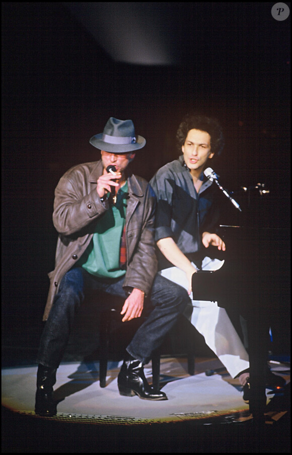 Michel Berger et Johnny Hallyday lors du concert de Michel Berger au Zénith de Paris en 1986.