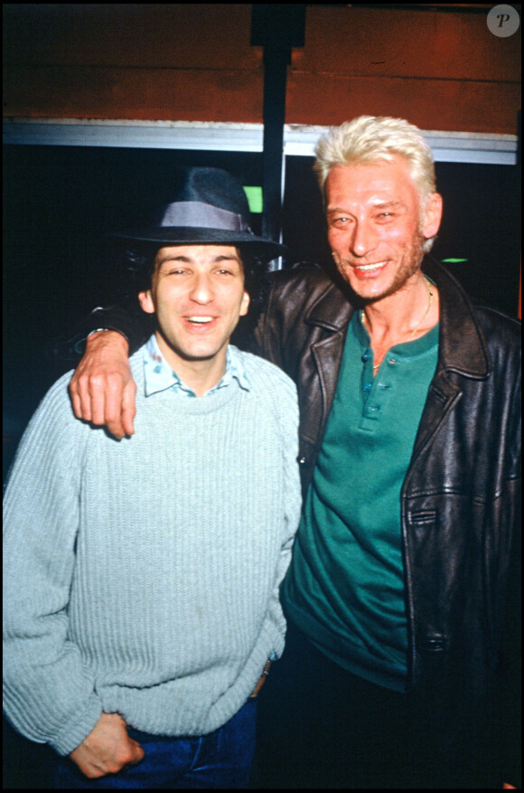Michel Berger et Johnny Hallyday lors du concert de Michel Berger au Zénith de Paris en 1986.
