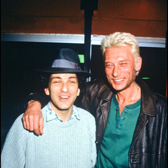 Michel Berger et Johnny Hallyday lors du concert de Michel Berger au Zénith de Paris en 1986.
