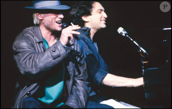 Michel Berger et Johnny Hallyday lors du concert de Michel Berger au Zénith de Paris en 1986.