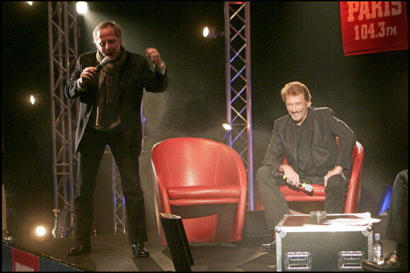 Johnny Hallyday et Fabrice Luchini au Grand Rex à Paris, pour la promotion du film "Jean-Philippe" en 2006.