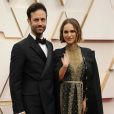 Natalie Portman (cape et robe Dior Haute Couture) et son mari Benjamin Millepied lors du photocall des arrivées de la 92ème cérémonie des Oscars 2020 au Hollywood and Highland à Los Angeles, le 9 février 2020.