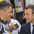 Le président de la République Emmanuel Macron et Romain Bardet lors de l'arrivée de la 17ème étape du 104ème Tour de France à Salle-des-Alpes (Serre Chevalier), le 19 juillet 2017. ©