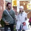 Exclusif - Amanda Seyfried promène son chien avec un ami dans la rue à New York le 7 décembre 2018. 
