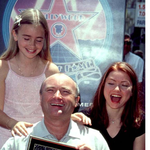 Phil Collins avec ses filles Lily et Joely à Hollywood Boulevard. Los Angeles.