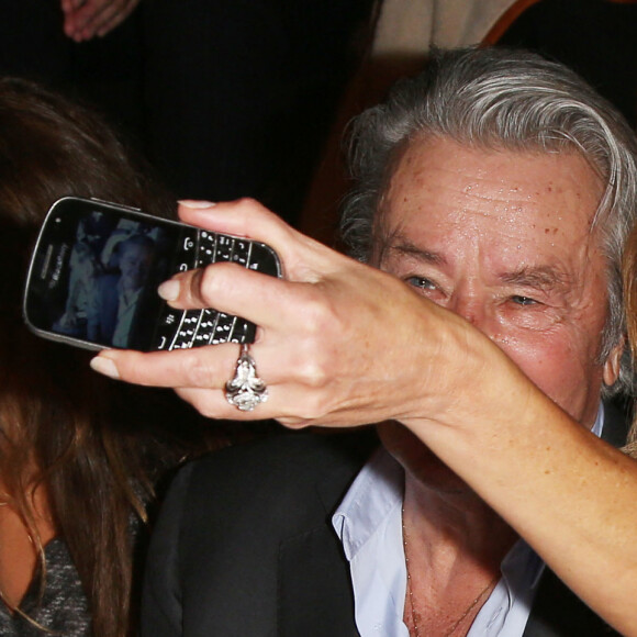 Alain Delon et Rosalie Van Breemen - People au defile de mode Elie Saab - Collection pret-a-porter printemps-ete 2013 - paris le 03/10/2012