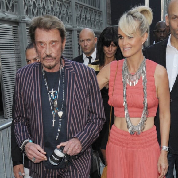 Johnny Hallyday et sa femme Laeticia Hallyday - Arrivée des people au défilé Saint Laurent Homme collection au Carreau du Temple lors de la Fashion Week à Paris. 2015