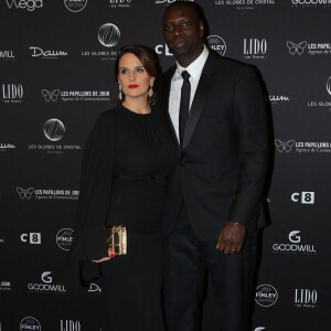 Omar Sy et sa femme Hélène au photocall de la 11ème cérémonie des Globes de Cristal au Lido à Paris le 30 janvier 2017. © CVS / Bestimage 
