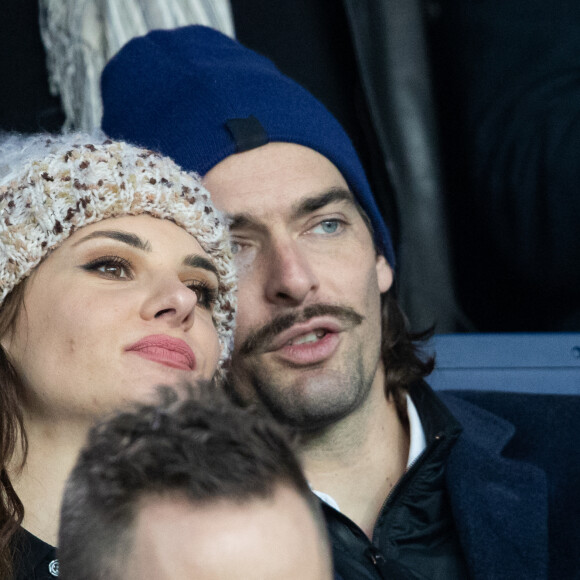 Camille Lacourt et sa compagne Alice Detollenaere (Miss Bourgogne 2010) dans les tribunes lors du match de championnat de Ligue 1 Conforama opposant le Paris Saint-Germain (PSG) aux Girondins de Bordeaux au Parc des Princes à Paris. © Cyril Moreau/Bestimage