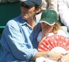 Jean-Luc Reichmann et sa fille au tournoi de tennis de Roland-Garros. 2002.