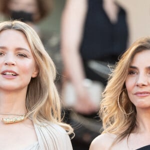 Virginie Efira et Clotilde Courau assistent à la montée des marches du film "Benedetta" au 74e Festival de Cannes, au Palais des Festivals. Cannes, le 9 juillet 2021.