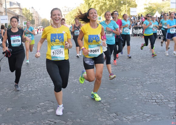 Fabienne Carat et sa soeur Carole - Course "La Parisienne 2014" pour la lutte contre le cancer, au Champs de Mars à Paris, le 14 septembre 2014.