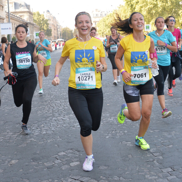 Fabienne Carat et sa soeur Carole - Course "La Parisienne 2014" pour la lutte contre le cancer, au Champs de Mars à Paris, le 14 septembre 2014.
