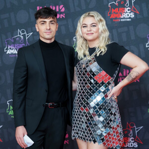 Louane Emera et son compagnon Florian Rossi posent à deux pour la première fois lors des NRJ Music Awards, à Paris.