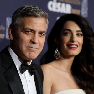 George Clooney (montre Omega) et sa femme Amal Alamuddin-Clooney (enceinte) - Photocall de la 42ème cérémonie des Cesar à la salle Pleyel à Paris. © Dominique Jacovides - Olivier Borde / Bestimage 