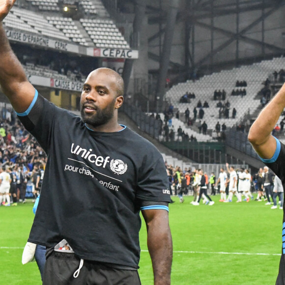 Teddy Riner, Tony Parker - Match des héros entre l'équipe OM Legends et l'équipe UNICEF au stade Orange Velodrome à Marseille le 13 octobre 2021. Soutenu par la Fondation D. Drogba, Orange et l'Olympique de Marseille, l'Unicef a organisé cette rencontre afin de financer un projet d'accès à l'éducation en Côte d'Ivoire. La Team OM de légende s'impose 7-4 au stade Vélodrome face à la Team Unicef. © Jean-René Santin/Bestimage