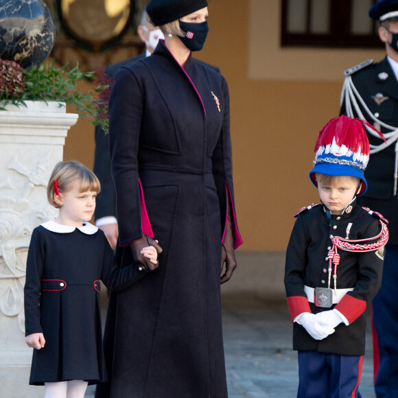 La princesse Charlène de Monaco, la princesse Gabriella de Monaco, comtesse de Carladès, le prince Jacques de Monaco, marquis des Baux - La famille princière assiste à une cérémonie de remise de médaille dans la cours du Palais de Monaco lors de la Fête Nationale 2020 de la principauté de Monaco le 19 novembre 2020. © David Nivière / Pool / Bestimage