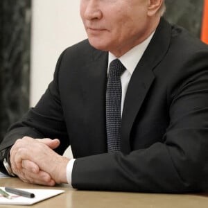 Le président russe Vladimir Poutine, quelques mois plus tôt, lors d'une réunion par vidéoconférence sur la sécurité de la Russie au Kremlin à Moscou, Russie le 26 février 2021.