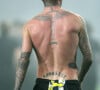David Beckham possède, comme son fils Romeo, un tatouage au cou. Janvier 2010.