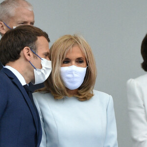 Le président de la République française, Emmanuel Macron, sa femme la Première Dame Brigitte Macron, et les membres du gouvernement français lors de la cérémonie du 14 juillet sur la place de la Concorde à Paris, France, le 14 juillet 2021.