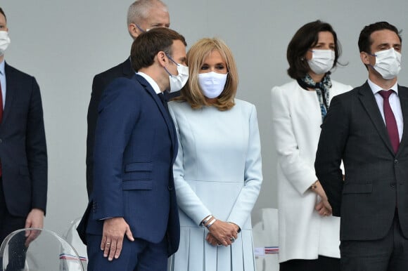 Le président de la République française, Emmanuel Macron, sa femme la Première Dame Brigitte Macron, et les membres du gouvernement français lors de la cérémonie du 14 juillet sur la place de la Concorde à Paris, France, le 14 juillet 2021.