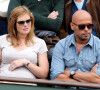 Eric Judor et sa nouvelle compagne enceinte aux Internationaux de France de tennis de Roland Garros à Paris, le 29 mai 2014.
