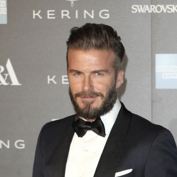 David Beckham et sa femme Victoria Beckham - Photocall du gala "Alexander McQueen : Savage Beauty" au Victoria and Albert Museum à Londres, le 12 mars 2015.
