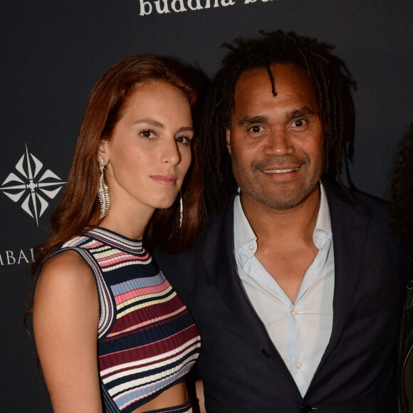 Christian Karembeu et sa femme Jackie Chamoun - A l'occasion des 20 ans de la victoire de l'équipe de France, les bleus 98 se sont rendus à un dîner organisé au Buddha Bar avec tous les joueurs et leur famille le 11 juin 2018. © Rachid Bellak/Bestimage