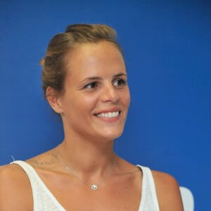 Laure Manaudou présente sa collection de maillots de bain 'Laure Manaudou Design' lors d'un défilé à la Piscine de Boulogne-Billancourt le 2 Juillet 2014. 