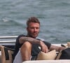 David Beckham, son fils Roméo avec sa petite amie Mia Regan profitent d'une promenade en bateau avec des amis à Miami avant le mariage de Brooklyn le 7 avril 2022. 